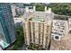 Aerial view of a high-rise building with a rooftop pool and surrounding city landscape at 3334 Peachtree Ne Rd # 1707, Atlanta, GA 30326