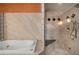 Luxurious bathroom boasting a soaking tub and separate shower with built-in bench seating at 3334 Peachtree Ne Rd # 1707, Atlanta, GA 30326