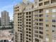 Exterior view of a tall building featuring multiple windows and balconies against a blue sky at 3334 Peachtree Ne Rd # 1707, Atlanta, GA 30326