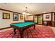Entertaining game room with a classic pool table, framed art, and soft lighting for leisure activities at 3334 Peachtree Ne Rd # 1707, Atlanta, GA 30326