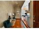 Stylish hallway showcasing hardwood floors, designer lighting, and a view into the kitchen and dining at 3334 Peachtree Ne Rd # 1707, Atlanta, GA 30326