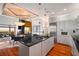 Modern kitchen with stainless steel appliances, granite countertops, and an adjacent dining area at 3334 Peachtree Ne Rd # 1707, Atlanta, GA 30326