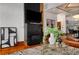 Stylish living room with a brick fireplace, hardwood floors, and modern decor for a chic and inviting atmosphere at 3334 Peachtree Ne Rd # 1707, Atlanta, GA 30326