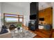 Bright living room featuring a fireplace, large windows with city views, and hardwood floors for a cozy and inviting atmosphere at 3334 Peachtree Ne Rd # 1707, Atlanta, GA 30326