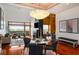 Spacious living room with adjacent dining area featuring a decorative chandelier and scenic views at 3334 Peachtree Ne Rd # 1707, Atlanta, GA 30326