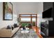 Spacious living room with a fireplace, hardwood floors, and floor to ceiling windows offering nice views at 3334 Peachtree Ne Rd # 1707, Atlanta, GA 30326