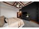 Beautiful bedroom with a dark accent wall, decorative ceiling, and balcony access, creating a stylish and relaxing retreat at 3334 Peachtree Ne Rd # 1707, Atlanta, GA 30326