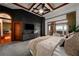 Serene bedroom with a brick accent wall, coffered ceiling, and balcony access creating a tranquil retreat for relaxation at 3334 Peachtree Ne Rd # 1707, Atlanta, GA 30326
