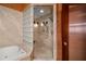 Modern shower design with glass blocks, updated shower head, and tile surround at 3334 Peachtree Ne Rd # 1707, Atlanta, GA 30326