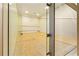 Clean and spacious squash court with wooden floors and glass walls for recreational use in a fitness center at 3334 Peachtree Ne Rd # 1707, Atlanta, GA 30326