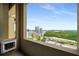 Balcony with city skyline views overlooking lush greenery and urban landscape at 3334 Peachtree Ne Rd # 1707, Atlanta, GA 30326