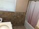Bathroom features a shower with curtain at 4485 Merlin Ne Cir, Douglasville, GA 30134