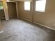Bedroom with carpet floor and natural light from windows at 4485 Merlin Ne Cir, Douglasville, GA 30134