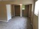 Bedroom with neutral-colored walls, carpet flooring, and closet at 4485 Merlin Ne Cir, Douglasville, GA 30134