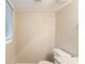 Bathroom with a toilet, vanity, window and neutral walls at 4669 Birch Ridge Trl, Stone Mountain, GA 30083