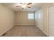 Bedroom with standard closet, neutral paint, ceiling fan and a window for natural light at 4669 Birch Ridge Trl, Stone Mountain, GA 30083