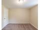 Bedroom featuring neutral walls, carpeted floor, a ceiling light, and a door at 4669 Birch Ridge Trl, Stone Mountain, GA 30083