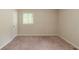 Bedroom with carpet, natural light from the window and neutral paint at 4669 Birch Ridge Trl, Stone Mountain, GA 30083