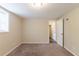 Bedroom featuring neutral walls, carpeted floor, and a view into another room at 4669 Birch Ridge Trl, Stone Mountain, GA 30083