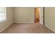 Bedroom features carpet, neutral paint, and natural light from the window at 4669 Birch Ridge Trl, Stone Mountain, GA 30083