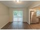 Open dining area with wood floors and sliding glass doors to the backyard patio at 4669 Birch Ridge Trl, Stone Mountain, GA 30083