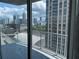 Balcony featuring a cityscape view with glass windows and grey railings at 361 17Th Nw St # 1303, Atlanta, GA 30363