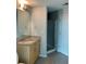 Bathroom featuring a granite vanity, large mirror and enclosed glass shower at 361 17Th Nw St # 1303, Atlanta, GA 30363