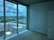 Bedroom with floor to ceiling windows, neutral carpet and beautiful city views at 361 17Th Nw St # 1303, Atlanta, GA 30363