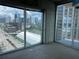 Enjoy the city skyline from this bedroom with direct balcony access, blending comfort and convenience at 361 17Th Nw St # 1303, Atlanta, GA 30363