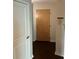 Home entrance features a wooden front door and light walls at 361 17Th Nw St # 1303, Atlanta, GA 30363
