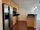 Bright kitchen with stainless steel appliances, black backsplash, and hardwood flooring at 361 17Th Nw St # 1303, Atlanta, GA 30363