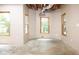Unfinished basement featuring natural light, exposed ceiling, and concrete flooring at 6435 Ivey Creek Cir, Cumming, GA 30040