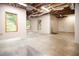 Large basement with windows and a door to the outside offers potential for customization at 6435 Ivey Creek Cir, Cumming, GA 30040