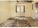 Basement area with direct outdoor access, rug, and unfinished ceiling at 6435 Ivey Creek Cir, Cumming, GA 30040