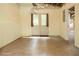 View of the unfinished basement with a door to the backyard and concrete floor at 6435 Ivey Creek Cir, Cumming, GA 30040