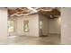 Unfinished basement area with natural light, featuring exposed ductwork and concrete floors at 6435 Ivey Creek Cir, Cumming, GA 30040