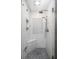 Modern walk-in shower with decorative tile and a built-in seat at 6435 Ivey Creek Cir, Cumming, GA 30040
