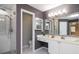 Bathroom with a double sink vanity, walk-in shower, and toilet at 6435 Ivey Creek Cir, Cumming, GA 30040