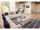 This living room is decorated with white sofas, blue pillows, a blue rug, and a white coffee table at 6435 Ivey Creek Cir, Cumming, GA 30040