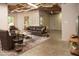 Spacious living room featuring exposed ductwork, concrete floors, and comfortable leather furniture at 6435 Ivey Creek Cir, Cumming, GA 30040