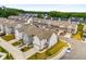 Street view featuring a row of modern homes, well-maintained lawns, and attached garages, showcasing neighborhood charm at 947 Edwin Ln, Sugar Hill, GA 30518