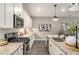 Well-lit kitchen showcasing granite countertops, stainless steel appliances, and white cabinetry at 947 Edwin Ln, Sugar Hill, GA 30518
