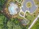 Aerial view of the community pool, playground, and parking areas at 134 Everley Walk, Alpharetta, GA 30009