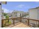 Balcony overlooking a community of townhomes on a sunny day at 134 Everley Walk, Alpharetta, GA 30009