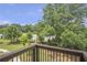 Enjoy nature views from this balcony overlooking lush green trees at 134 Everley Walk, Alpharetta, GA 30009