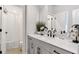 Modern bathroom with a white vanity, black fixtures, and a tiled shower at 134 Everley Walk, Alpharetta, GA 30009