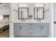 Stylish double vanity bathroom with grey cabinetry, quartz countertop, and modern fixtures at 134 Everley Walk, Alpharetta, GA 30009