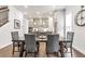 Dining area featuring hardwood floors with views into the kitchen at 134 Everley Walk, Alpharetta, GA 30009