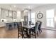 Dining area showcasing hardwood floors and views into the kitchen at 134 Everley Walk, Alpharetta, GA 30009