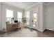 Bright home office with desk, chair, rug, hardwood floors and natural lighting at 134 Everley Walk, Alpharetta, GA 30009